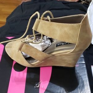 Tan suede wedge. Never worn
